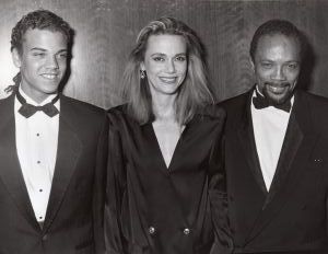 Quincy Jones , Peggy Lipton, and son, Quincy III at TJ Martel Foundation dinner, NY, 1986.jpg